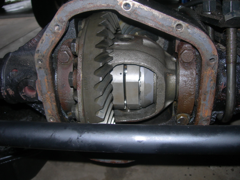 Close-up of an open differential housing showing gears and internal components