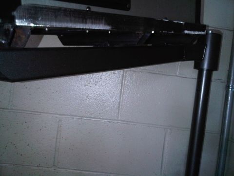 1996 Ford Bronco - A metal shelving unit is shown against a cinder block wall.