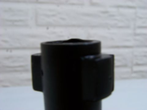 1995 Mercury Grand Marquis - A black automotive part with two protrusions is shown against a white brick wall. The registry information may be incorrect.