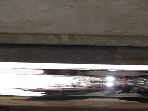 1973 Ford Ranchero - Rear view of a 1973 Ford Ranchero, highlighting its chrome bumper and lower body panel.