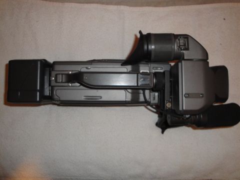 1993 Ford Taurus - A camcorder is shown from above, resting on a textured surface.