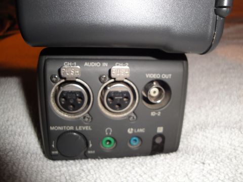 1993 Ford Taurus - Close-up view of the audio input and video output ports on a camera accessory unit.