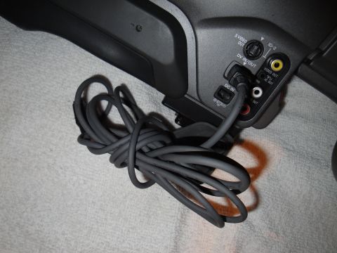 1993 Ford Taurus - Close-up of camcorder input/output ports and a connected power cable.