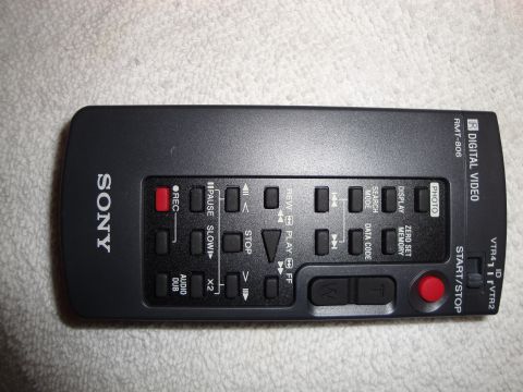 1993 Ford Taurus - A black Sony remote control for a digital video recorder is shown from a top-down perspective.