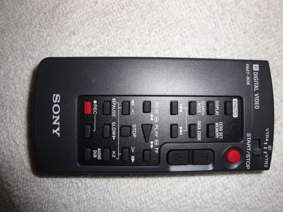 Black Sony remote control with buttons for REC, PAUSE, SLOW, STOP, PLAY, FF, REW, SEARCH MODE, DATA CODE, DISPLAY, ZERO SET MEMORY, PHOTO, START/STOP, AUDIO DUB, and X2