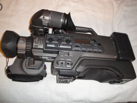 1993 Ford Taurus - A professional video camera with a 20x zoom lens and 3CCD sensor is shown.
