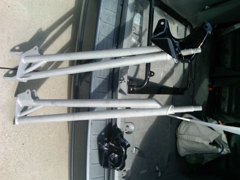 1986 Ford Bronco - Radius arms and mounting brackets are visible, likely for a vehicle's suspension system.
