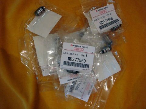 2000 Mitsubishi Montero - Several Mitsubishi valve adjusters are shown, each packaged with a part number label.