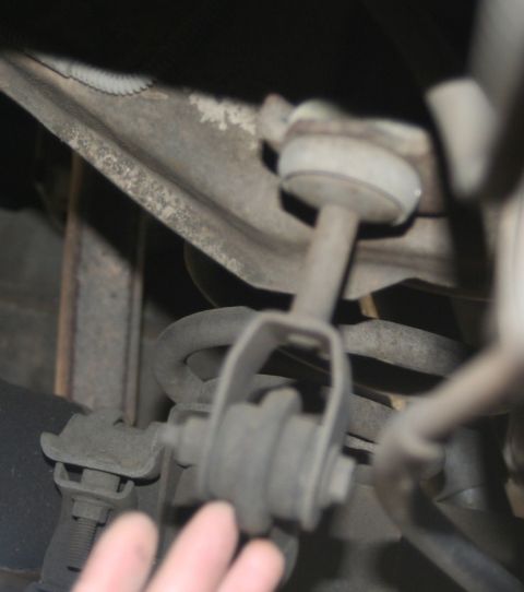 1976 Ford Ranchero - A close-up view of a suspension sway bar link, likely from a vehicle's undercarriage.