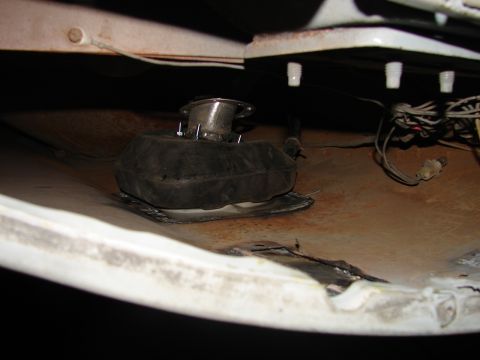 1973 Ford Ranchero - Close-up view of a vehicle's undercarriage, revealing mechanical components and wiring.