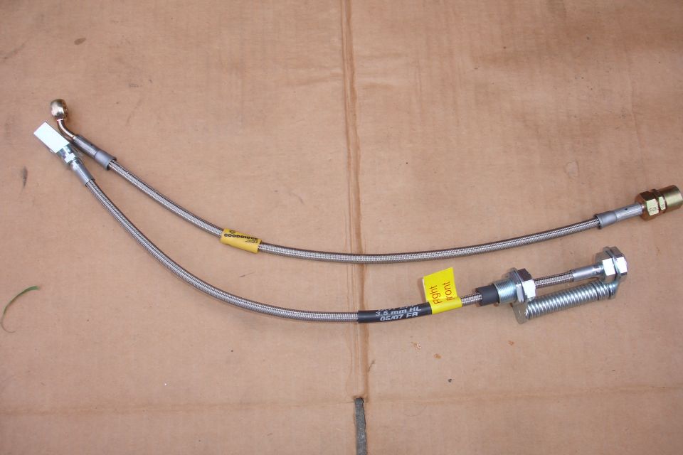 Two stainless steel brake lines with yellow tags, one labeled 'Right front'