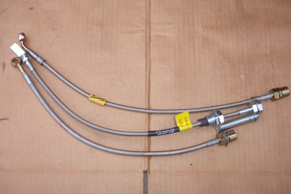 Three stainless steel brake lines with yellow tags, one labeled 'Right front'