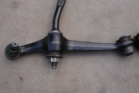 1995 Ford Taurus - Front lower control arm with ball joint, part of the suspension system.