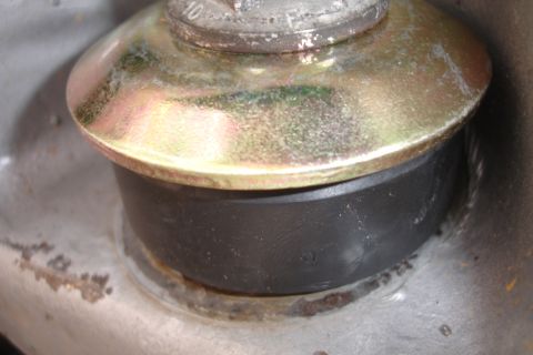 1995 Ford Taurus - This image shows a close-up of a rubber bushing and metal hardware, not a 1995 Ford Taurus.