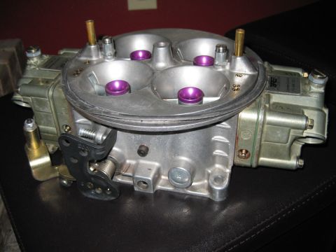 1994 Ford F-150 - A detailed view of a Holley carburetor, a critical engine component, is shown from a slightly elevated angle.