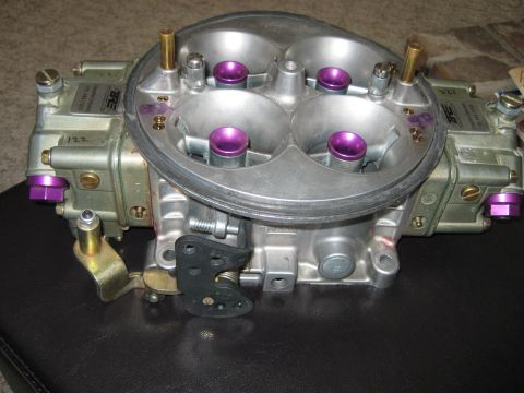1994 Ford F-150 - Close-up of a Holley carburetor, likely an aftermarket performance part.