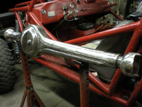 2009 Suzuki Samurai - A custom-built buggy's front axle assembly is shown, mounted on red jack stands.