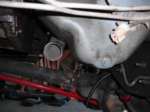 1991 Ford Bronco - Undercarriage view showing a custom exhaust pipe installation.