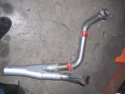 1991 Ford Bronco - A custom exhaust Y-pipe is shown on a concrete floor.