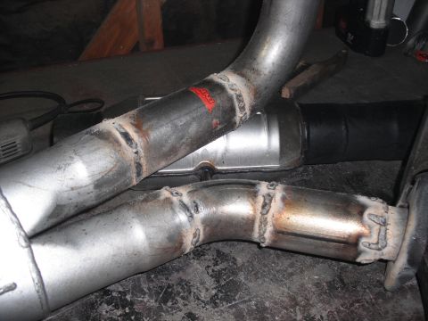 1991 Ford Bronco - Custom exhaust pipe section with visible welds and a muffler.