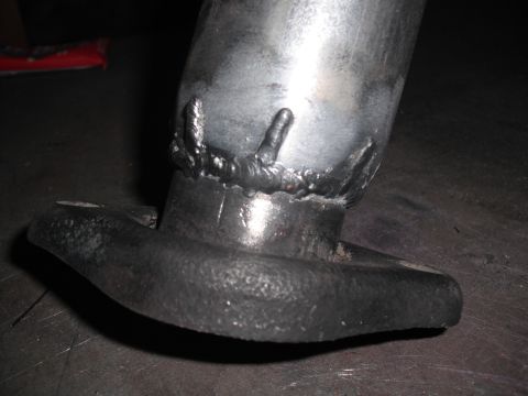 1991 Ford Bronco - A close-up view shows the welds on a custom exhaust pipe connected to a flange.