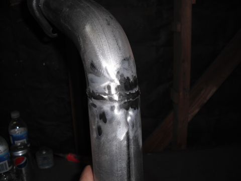 1991 Ford Bronco - Exhaust pipe section showing a welded joint, likely a custom modification.