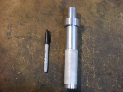 2009 Suzuki Samurai - A metal tool and a marker are shown on a textured surface.