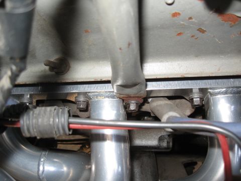 1994 Ford Bronco - Engine bay detail showing exhaust manifold and wiring harness connections.