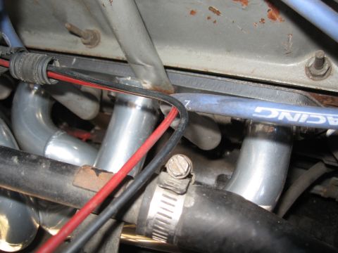 1994 Ford Bronco - Detail shot of engine components including exhaust headers and spark plug wires.