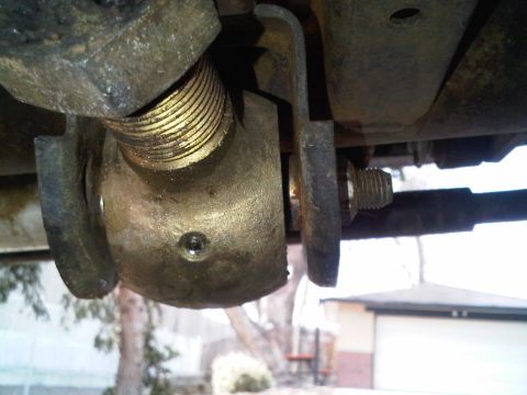 2008 Jeep Wrangler - Detail of a suspension component, showing a bolt and mounting bracket.