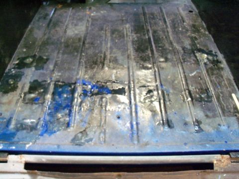 1978 Jeep CJ5 - The interior floor of a 1978 Jeep CJ5 shows significant rust and repair work.