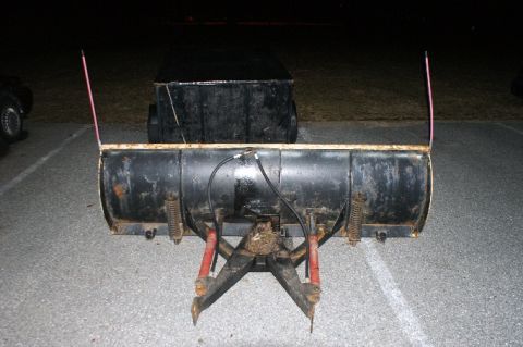 1979 Ford Bronco - This snow plow attachment is mounted on a vehicle, ready for winter conditions.