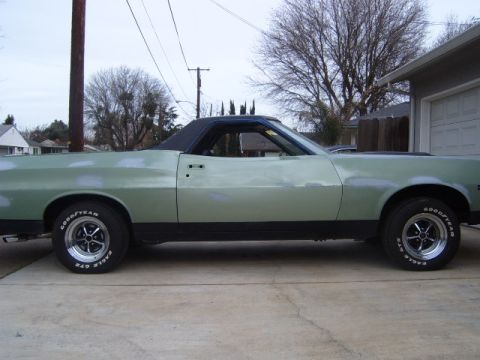 1973 Ford Ranchero - This light green 1972 Ford Ranchero pickup truck is shown from the side, a black vinyl roof and aftermarket wheels.