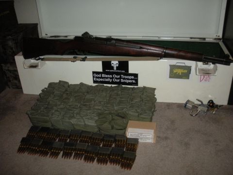 1996 Ford Bronco - M1 Garand rifle and ammunition displayed on a chest with a "God Bless Our Troops" sticker.