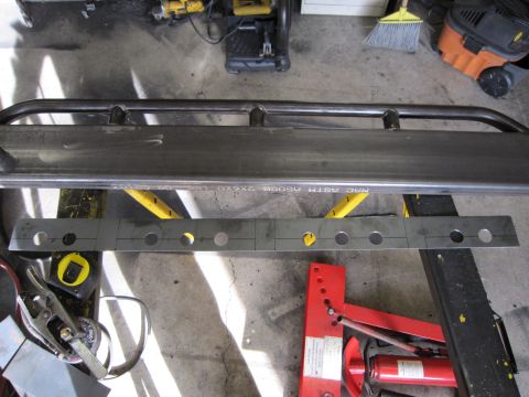 1996 Ford Bronco - Custom metal parts, possibly for a vehicle modification, are shown with fabrication tools in a workshop setting.