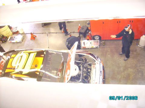 1978 Ford Bronco - Race car being worked on in a garage with crew members present. Date stamp shows 09/01/2006.