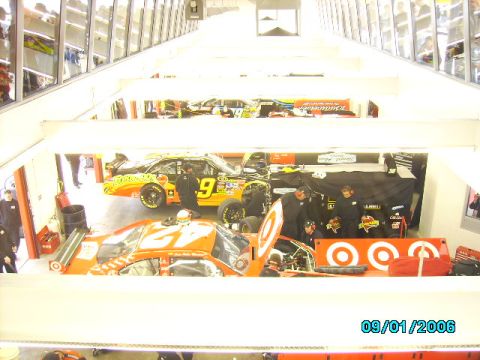 1978 Ford Bronco - Race cars and crew members are visible inside a garage bay, with a date stamp of 09/01/2006.