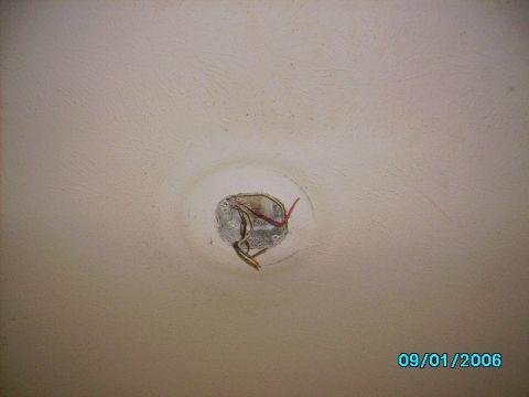 1978 Ford Bronco - Exposed electrical wiring is visible in a ceiling junction box, with a date stamp of 09/01/2006.
