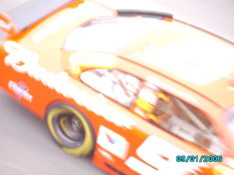 1978 Ford Bronco - A blurry orange race car is seen from the side, with a date stamp of 09/01/2006.