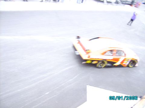 1978 Ford Bronco - A race car with a large rear spoiler is seen on a track with a date stamp of 09/01/2006.