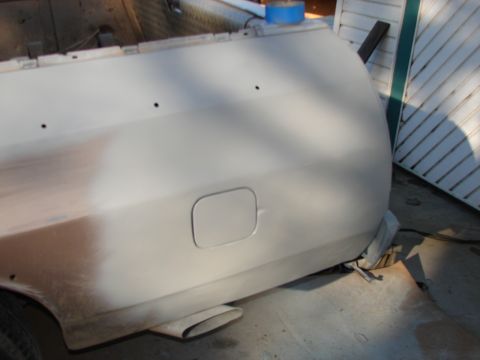 1973 Ford Ranchero - The rear quarter panel of a vehicle, possibly undergoing repair or preparation for painting, is visible.