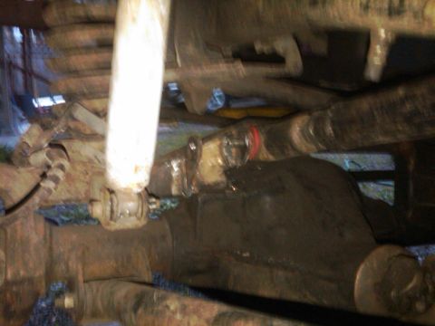 1978 Ford Bronco - Undercarriage view shows suspension and drivetrain components, likely from an older vehicle.