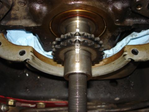 1992 Ford Bronco - This image shows a close-up view of an engine's timing gear and shaft, with blue shop towels visible underneath.