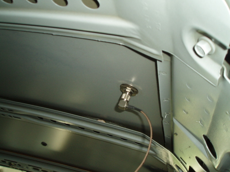 Mounted from the bottom, this cord is hidden until it comes up the carpet though the powerseat wiring cut, under the driver seat to be used in the center console for a Garmin GPS.

The LX headliner doesn't have any problems with this Antenna.