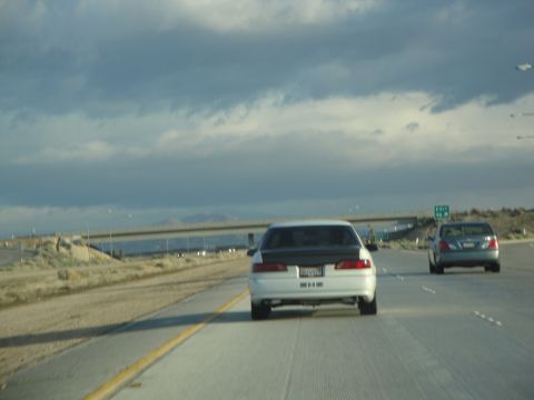 1995 Ford Taurus - Driving on the highway with another car ahead.