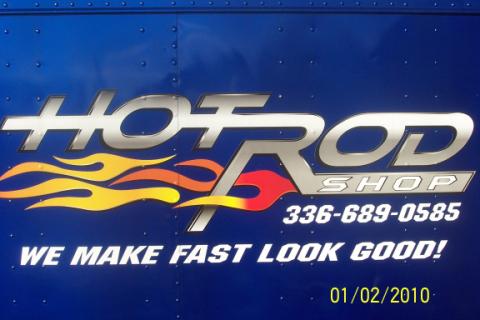 1992 Ford Mustang - A blue surface displays the "Hot Rod Shop" logo, contact information, and a slogan.