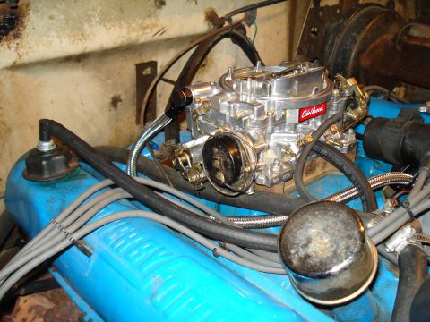 1967 Ford F-250 - The engine features a prominent Edelbrock carburetor and blue painted valve covers.