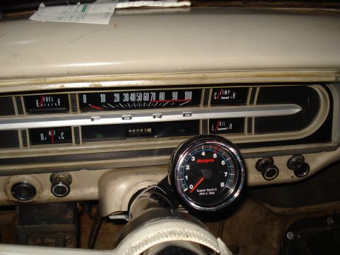 1967 Ford F-250 - The interior of a 1967 Ford F-250 shows its original gauges and an added tachometer.