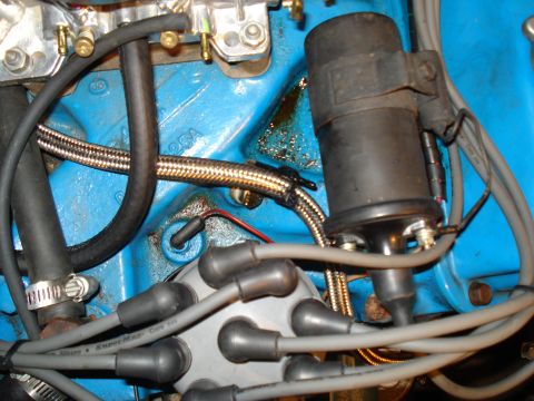 1967 Ford F-250 - Engine bay detail showing distributor cap, ignition coil, and fuel lines.