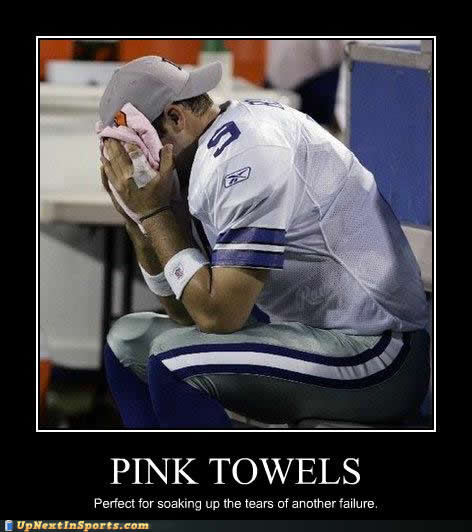 1989 Ford Bronco - A dejected football player uses a pink towel to wipe his face.